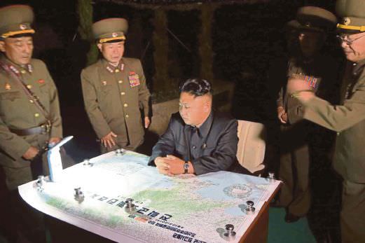 NK leader inspects rocket firing drill